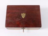 a small wooden box with a gold heart on it