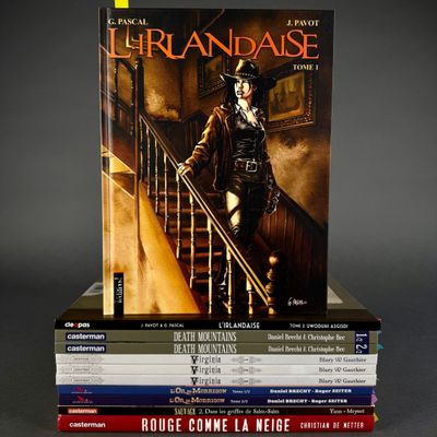 books stacked on top of each other on a gray surface