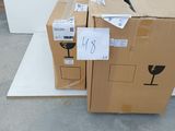 two boxes sitting on the floor next to each other