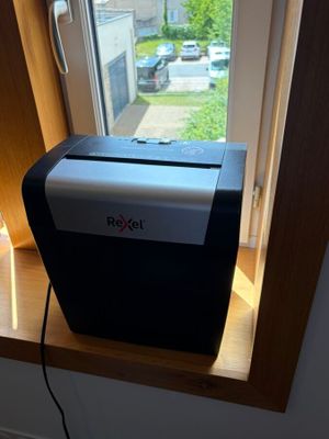an image of a small window with a paper shredder in it