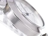 a close up of a watch on a white surface