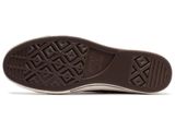 the sole of a pair of brown and white shoes on a white background