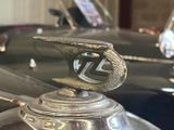 a close up of a car hood ornament on the hood of a car