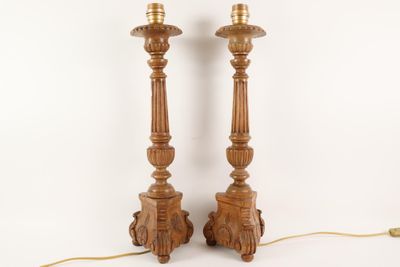 pair of carved wood candlesticks with turned heads