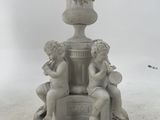 a statue of two cherenshes sitting on top of a fountain