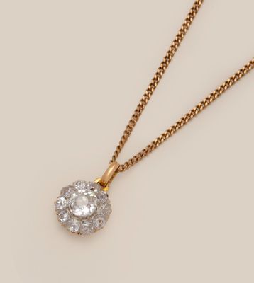 an image of a diamond pendant on a gold chain