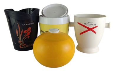 three cups and a jug sitting next to each other