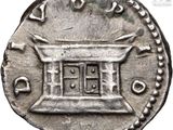 a silver coin with a small window in the middle of it