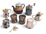 many different types of teapots and cups on the table
