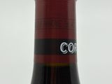a bottle of wine that is sitting on a table