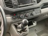 a dashboard of a car with a steering wheel and a control panel