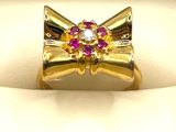 bague en or jaune sertie de pierres roses et blanches