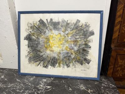 tableau représentant un tournesol dans un cadre bleu, posé sur un sol en marbre