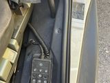 a remote control in the front seat of a car