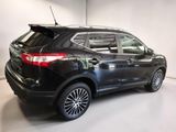 the back of a black ford suv parked in a garage