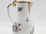 an image of a white and gold coffee pot
