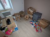 a room with a lot of boxes and boxes on the floor