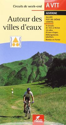 a man riding a bike on a trail in the mountains