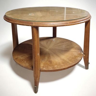 a round table with a glass top on a white background