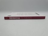 a red book sitting on top of a white table