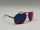 the red and black sunglasses are on a white surface