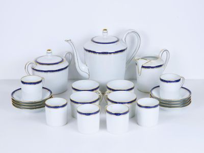 a white and blue tea set with cups and saucers