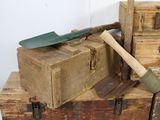 a wooden box with a shovel on top of it