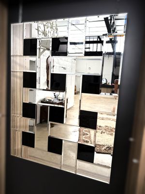 a mirror that is on the wall in the room