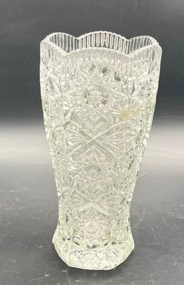 a glass vase that is sitting on a table