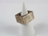 a white cone with a gold ring on top of it