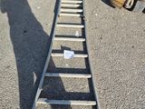 a ladder that is sitting in the middle of a parking lot