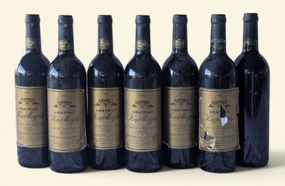 six bottles of wine are lined up in a row