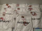 several bags of white t - shirts with the words place du jour written on them