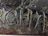 a close up of a rock with writing on it