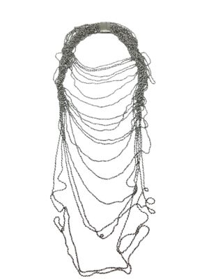 silver metal chain necklace with beads and chains hanging from it ' s neck