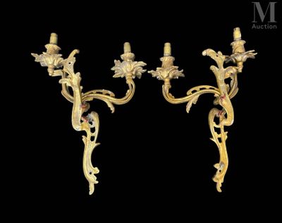 a pair of antique wall sconces with flowers and leaves