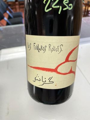 a bottle of wine on a table with a sticker on it
