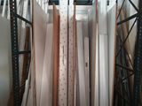 a lot of sheets of paper on a shelf in a room