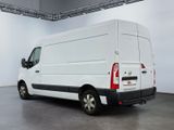 the white van is parked in a large room with a gray floor