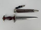 a knife and a knife holder on a table