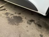 a car that has a lot of dirt on the side of the road