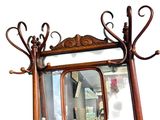 a mirror on the wall with a shelf underneath it
