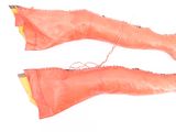 a pair of orange gloves that are on a white surface