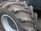 a large tractor tire that is sitting on the ground