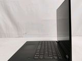 a laptop that is sitting on a white surface