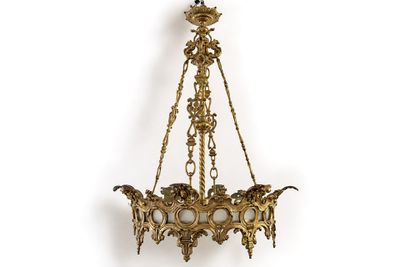 an antique brass chandelier hanging from the ceiling