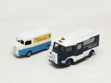 two toy vehicles that are next to each other on a white surface