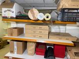 many boxes and boxes on the shelves in the room