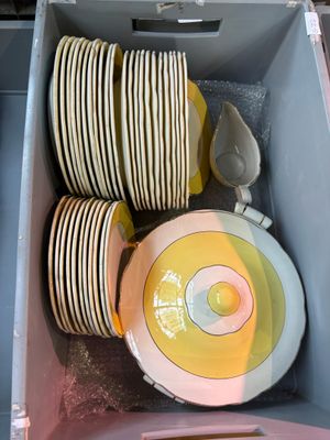 a lot of plates and bowls in a box