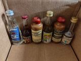 many bottles of alcohol sitting in a cardboard box